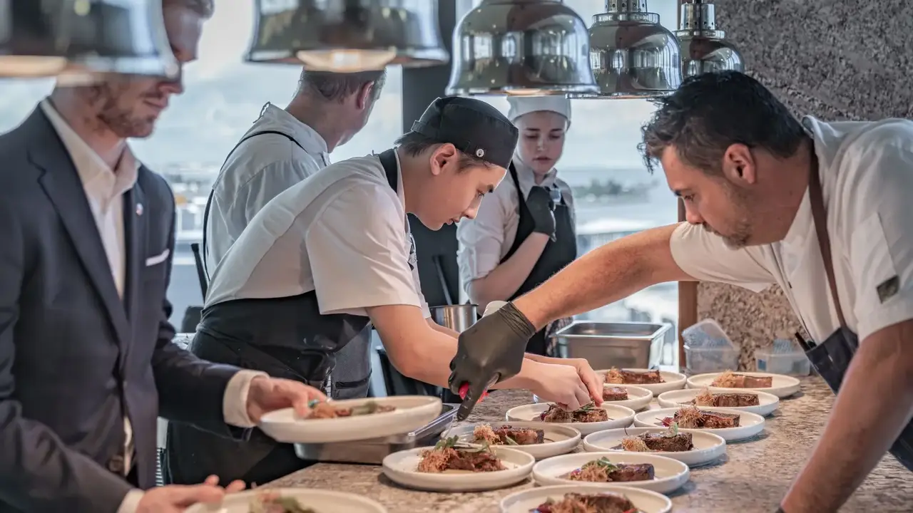 Chefs plating gourmet dishes at Crystalbrook Kingsley during Newcastle Food Month culinary event