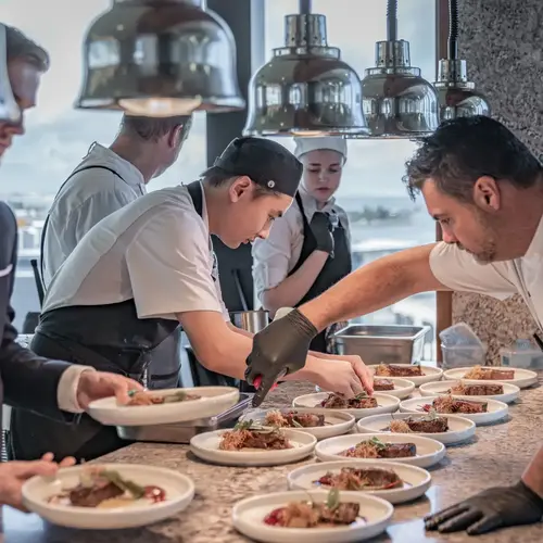 Chefs plating gourmet dishes at Crystalbrook Kingsley during Newcastle Food Month culinary event