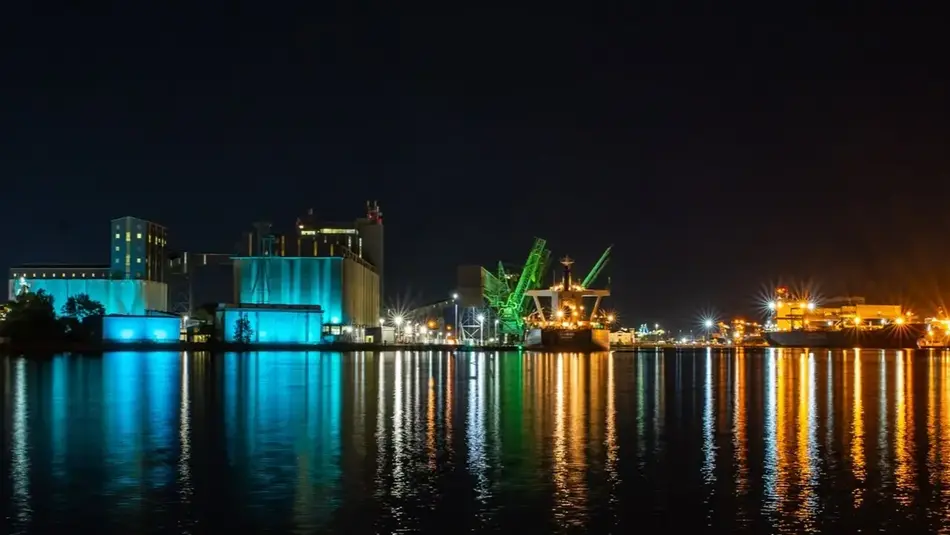 Newcastle Port at nighttime with colourful reflections over water